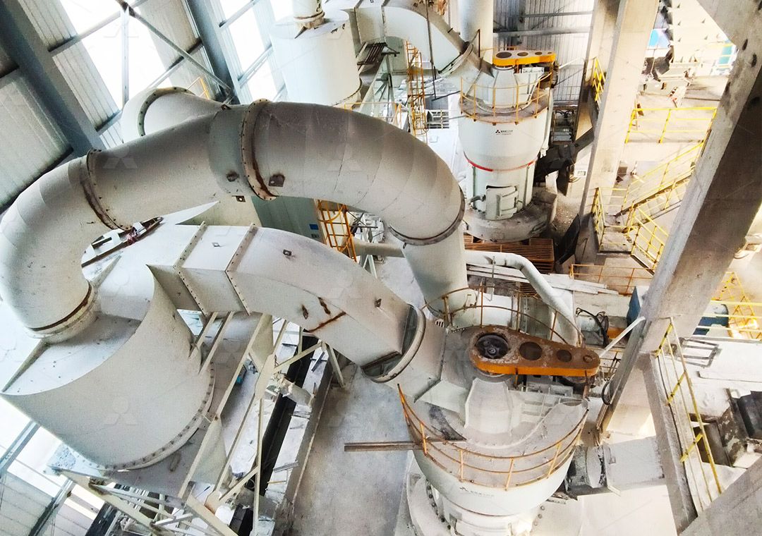 Industrial gypsum grinding process showing fine powder production