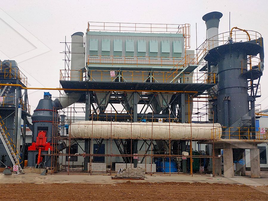 Vertical grinding mill processing quicklime in industrial setting