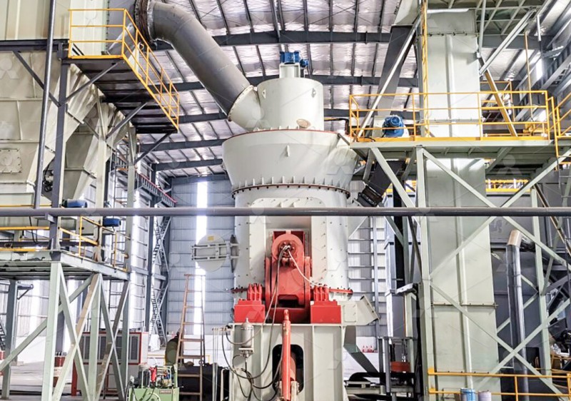 A large industrial vertical grinding mill installed in a modern processing plant