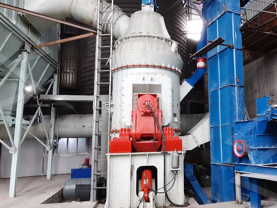 Engineering team installing a vertical grinding mill at a South African phosphate plant with safety equipment
